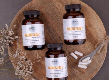 three bottles of magnesum on a wooden plate