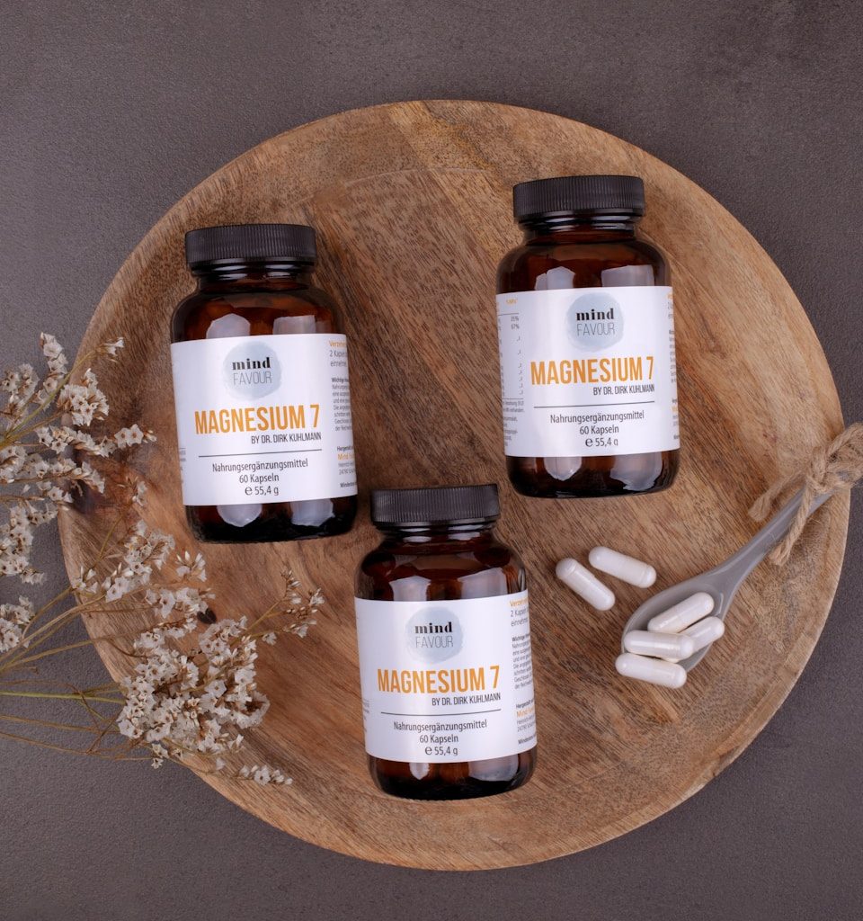 three bottles of magnesum on a wooden plate